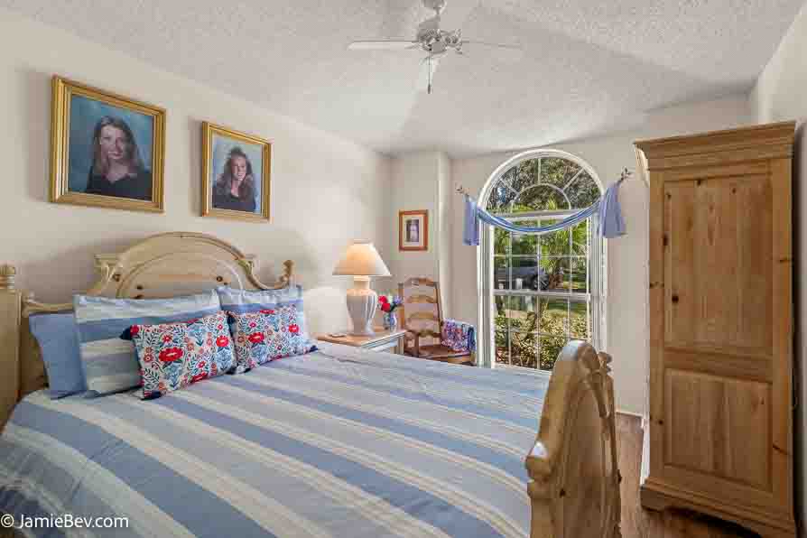 Nice bedroom with natural light and vinyl plank flooring.