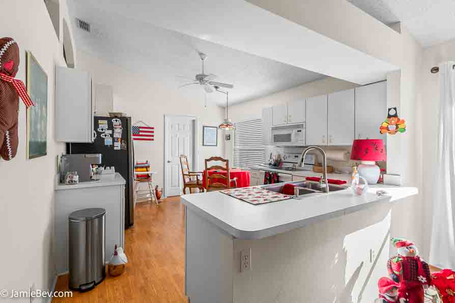 Contemporary kitchen with stainless steel appliances and sleek counters.