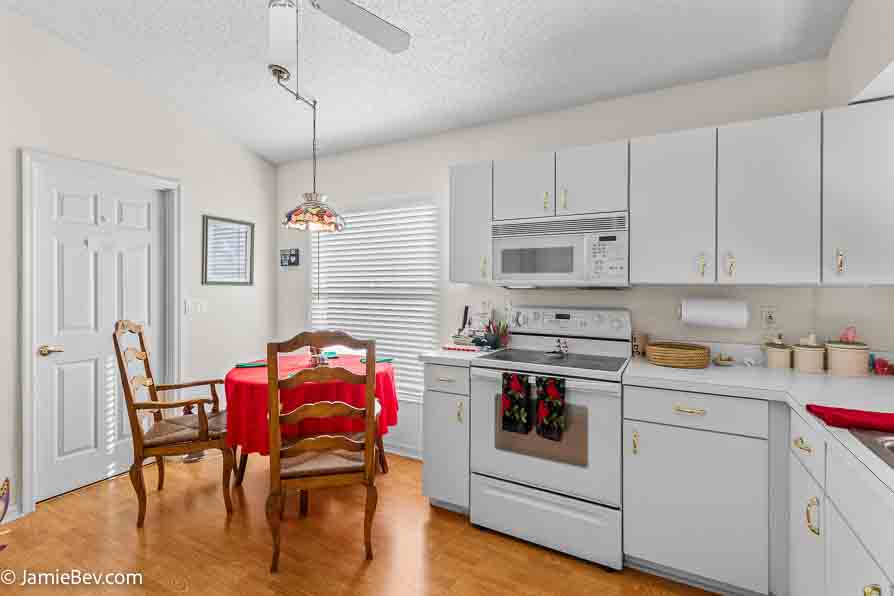 Contemporary kitchen with stainless steel appliances and sleek counters.
