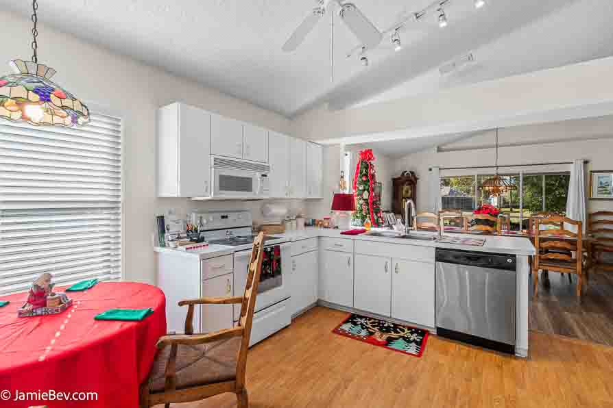 Contemporary kitchen with stainless steel appliances and sleek counters.
