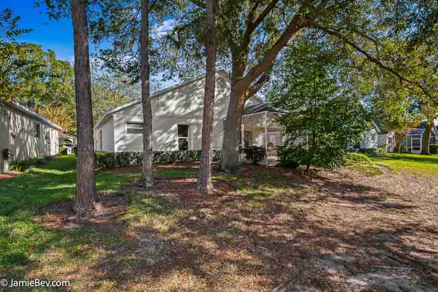 Screened patio overlooking the lush Kings Ridge golf course.