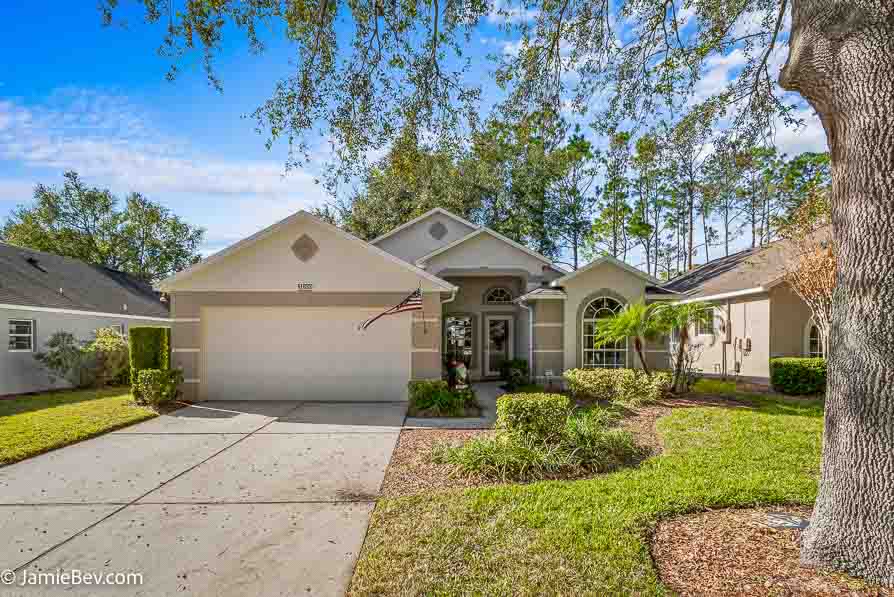 Front view of a home with a pristine exterior in a gated 55+ Clermont Florida community.