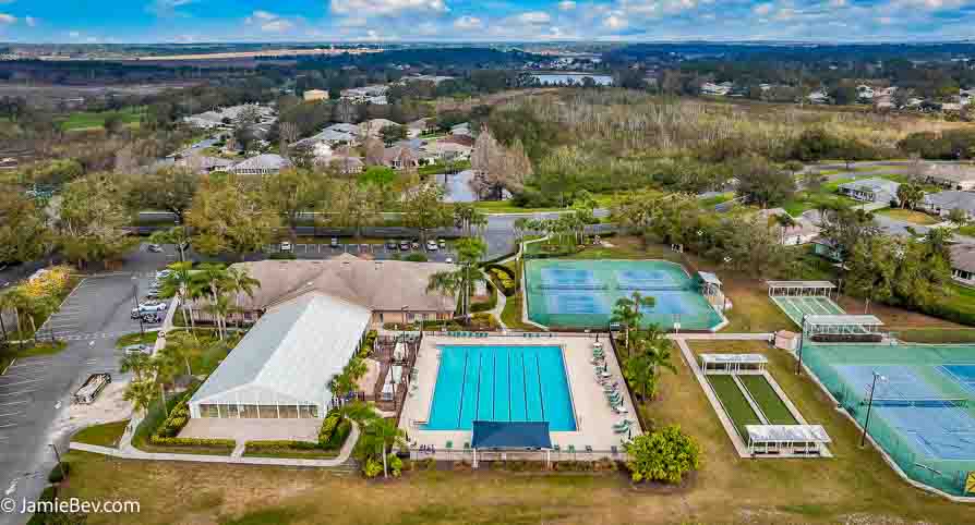 Aerial view of the Royal Highlands community, showing the golf course, lakes, and lush green spaces.