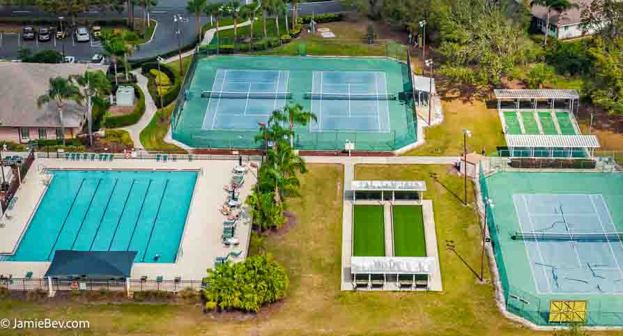 Aerial view of the Royal Highlands community, showing the golf course, lakes, and lush green spaces.