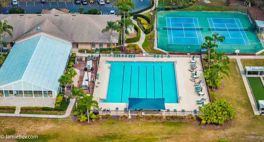 Aerial view of the Royal Highlands community, showing the golf course, lakes, and lush green spaces.