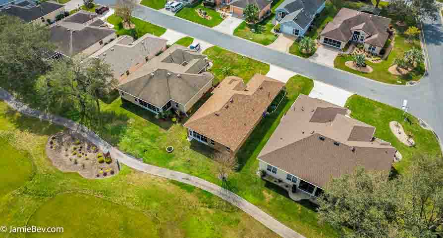 Aerial view of the Royal Highlands community, showing the golf course, lakes, and lush green spaces.