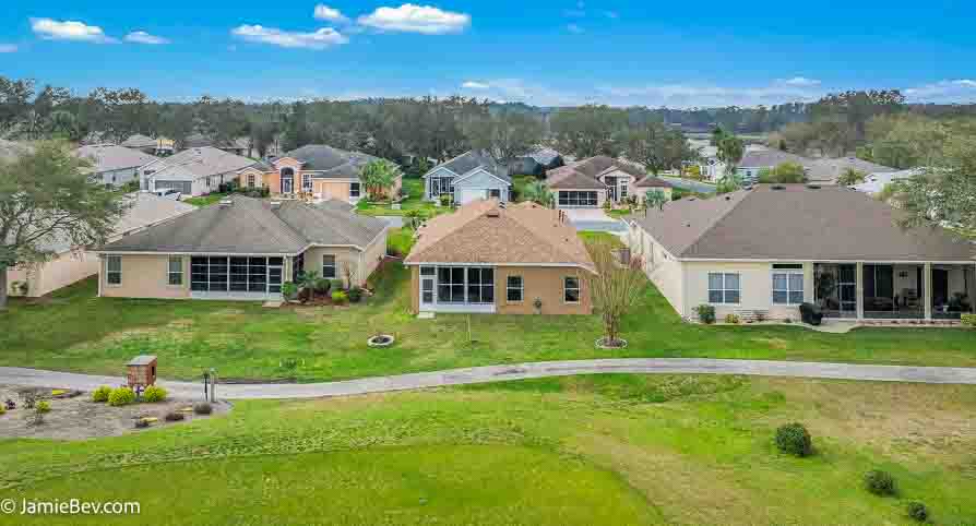 Aerial view of the Royal Highlands community, showing the golf course, lakes, and lush green spaces.