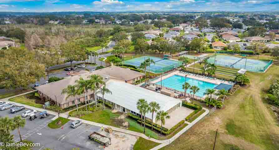 Aerial view of the Royal Highlands community, showing the golf course, lakes, and lush green spaces.