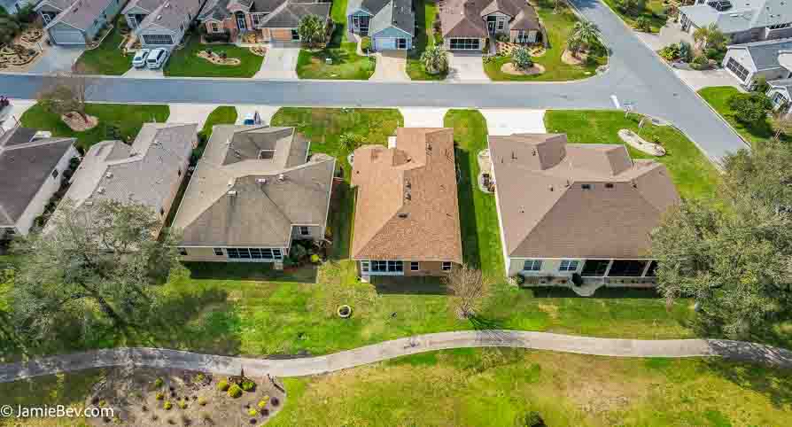 Aerial view of the Royal Highlands community, showing the golf course, lakes, and lush green spaces.