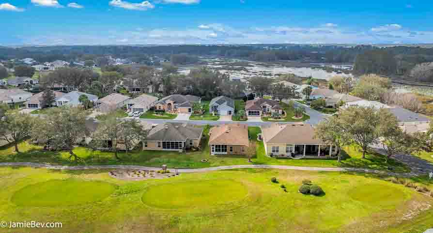 Aerial view of the Royal Highlands community, showing the golf course, lakes, and lush green spaces.