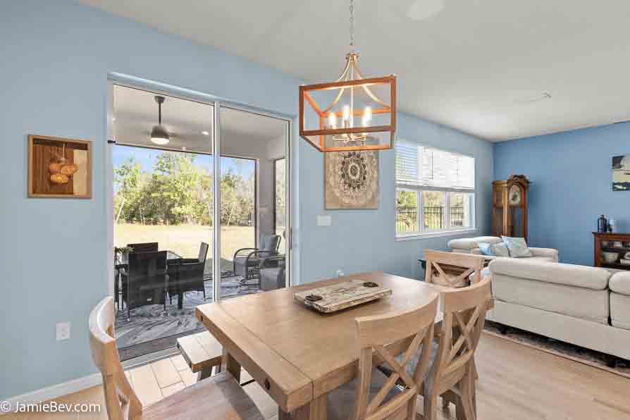 Open-concept gathering room with large windows and elegant finishes.
