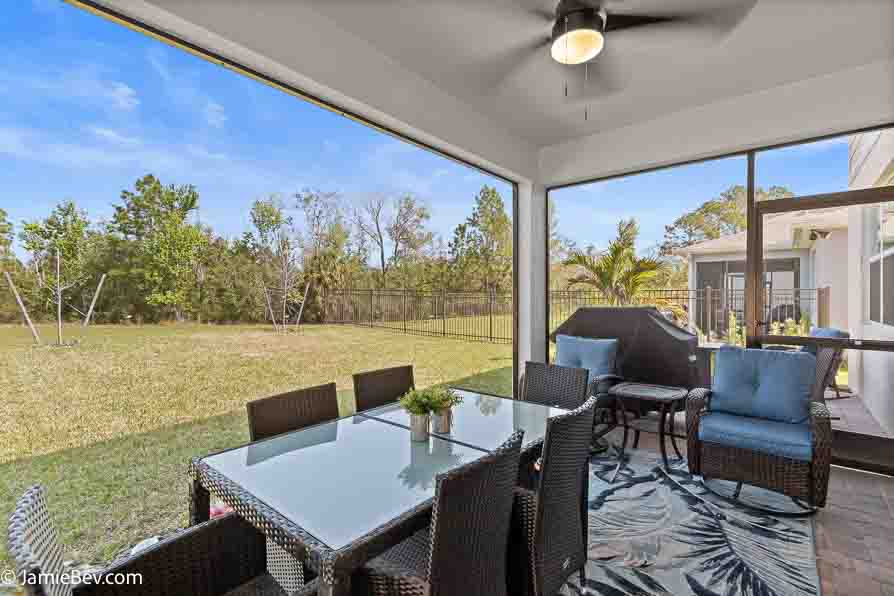 A beautifully designed home in the Serenoa Lakes community, featuring modern finishes and a spacious layout with no rear neighbors.
