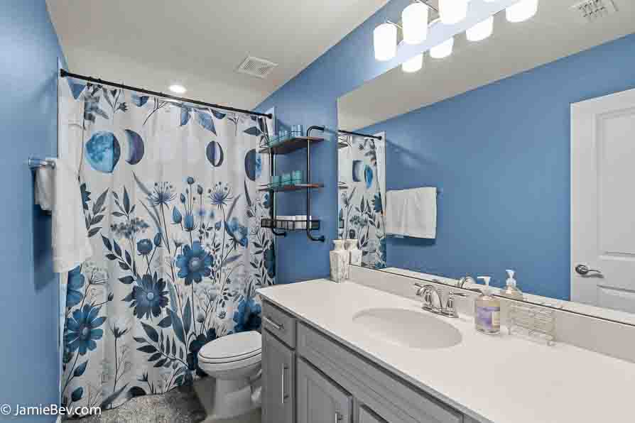 A beautifully designed home in the Serenoa Lakes community, featuring modern finishes and a spacious layout with no rear neighbors.
